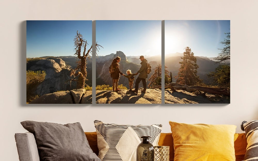 Split canvas wall display featuring multiple size arrangements in a modern interior